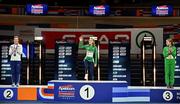 9 March 2025; Sarah Healy of Ireland steps up to receive her gold medal after winning the women's 3000m final, in the company of silver medallist Melissa Courtney-Bryant of Great Britain and bronze medallist Salomé Afonso of Portugal, on day four of the European Athletics Indoor Championships 2025 at the Omnisport Apeldoorn in Apeldoorn, Netherlands. Photo by Sam Barnes/Sportsfile