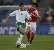 8 September 2004; Roy Keane, Republic of Ireland, in action against Bernt Haas, Switzerland. FIFA 2006 World Cup Qualifier, Switzerland v Republic of Ireland, St. Jakob Park, Basle, Switzerland. Picture credit; Brian Lawless / SPORTSFILE
