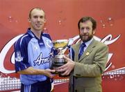 11 September 2004; Sean Kelly, President of the GAA, presents the cup to Dublins Eoin Kennedy. Coca Cola All-Ireland 60 x 30 Handball Finals, Senior Singles Event, Eoin Kennedy, Dublin v Barry Goff, Wexford, Croke Park, Dublin. Picture credit; Pat Murphy / SPORTSFILE