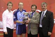 11 September 2004; Sean Kelly, President of the GAA, presents the trophy to Dublin's Eoin Kennedy with Coca Cola Events Manager Louise Keane and Handball President Tony Hayes, right. Coca Cola All-Ireland 60 x 30 Handball Finals, Senior Singles Event, Eoin Kennedy, Dublin v Barry Goff, Wexford, Croke Park, Dublin. Picture credit; Pat Murphy / SPORTSFILE