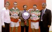 11 September 2004; Sean Kelly, Preident of the GAA, centre, presents the trophy to Mayo's Joe McCann, left, and Campbell Brennan, with Coca Cola Events manager Louise Keane and Handball President Tony Hayes. Coca Cola All-Ireland 60 x 30 Handball Finals, Intermrdiate Doubles Event, Niall Kerr, Ciaran Meenagh, Tyrone, v Campbell Brennan, Joe McCann, Mayo, Croke Park, Dublin. Picture credit; Pat Murphy / SPORTSFILE