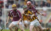 12 September 2004; Maurice Nolan, Kilkenny, in action against John Lee and Martin Ryan, left, Galway. All-Ireland Minor Hurling Championship Final, Galway v Kilkenny, Croke Park, Dublin. Picture credit; Brian Lawless / SPORTSFILE *** Local Caption *** Any photograph taken by SPORTSFILE during, or in connection with, the 2004 Guinness All-Ireland Hurling Final which displays GAA logos or contains an image or part of an image of any GAA intellectual property, or, which contains images of a GAA player/players in their playing uniforms, may only be used for editorial and non-advertising purposes.  Use of photographs for advertising, as posters or for purchase separately is strictly prohibited unless prior written approval has been obtained from the Gaelic Athletic Association.
