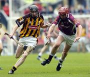 12 September 2004; Gavin Nolan, Kilkenny, in action against Ciaran O'Donavan, Galway. All-Ireland Minor Hurling Championship Final, Galway v Kilkenny, Croke Park, Dublin. Picture credit; Damien Eagers / SPORTSFILE *** Local Caption *** Any photograph taken by SPORTSFILE during, or in connection with, the 2004 Guinness All-Ireland Hurling Final which displays GAA logos or contains an image or part of an image of any GAA intellectual property, or, which contains images of a GAA player/players in their playing uniforms, may only be used for editorial and non-advertising purposes.  Use of photographs for advertising, as posters or for purchase separately is strictly prohibited unless prior written approval has been obtained from the Gaelic Athletic Association.