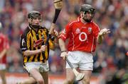 12 September 2004; Wayne Sherlock, Cork, in action against Martin Comerford, Kilkenny. Guinness All-Ireland Senior Hurling Championship Final, Cork v Kilkenny, Croke Park, Dublin. Picture credit; Brendan Moran / SPORTSFILE *** Local Caption *** Any photograph taken by SPORTSFILE during, or in connection with, the 2004 Guinness All-Ireland Hurling Final which displays GAA logos or contains an image or part of an image of any GAA intellectual property, or, which contains images of a GAA player/players in their playing uniforms, may only be used for editorial and non-advertising purposes.  Use of photographs for advertising, as posters or for purchase separately is strictly prohibited unless prior written approval has been obtained from the Gaelic Athletic Association.