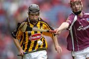12 September 2004; Richard Hogan, Kilkenny, in action against Ciaran O'Donovan, Galway. All-Ireland Minor Hurling Championship Final, Galway v Kilkenny, Croke Park, Dublin. Picture credit; Ray McManus / SPORTSFILE *** Local Caption *** Any photograph taken by SPORTSFILE during, or in connection with, the 2004 Guinness All-Ireland Hurling Final which displays GAA logos or contains an image or part of an image of any GAA intellectual property, or, which contains images of a GAA player/players in their playing uniforms, may only be used for editorial and non-advertising purposes.  Use of photographs for advertising, as posters or for purchase separately is strictly prohibited unless prior written approval has been obtained from the Gaelic Athletic Association.