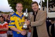 11 September 2004; Billy Finn, General Manager AIB Bank,  presents the cup to Portumna captain Ollie Canning. AIB Kilmacud Crokes All-Ireland Hurling Sevens 2004 Final, Portumna v Mullinahone, Kilmacud Crokes, Glenalbyn, Stillorgan, Dublin. Picture credit; Ray McManus / SPORTSFILE