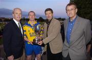 11 September 2004; Billy Finn, General Manager AIB Bank, second from right, presents the cup to Portumna captain Ollie Canning in the company of American Ambassador James J. Kenny, left, and Tom Rock, Chairman of the Kilmacud Crokes Sevens Organising Committee. AIB Kilmacud Crokes All-Ireland Hurling Sevens 2004 Final, Portumna v Mullinahone, Kilmacud Crokes, Glenalbyn, Stillorgan, Dublin. Picture credit; Ray McManus / SPORTSFILE