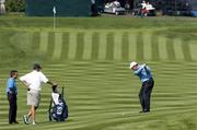 13 September 2004; Phil Mickelson, Team USA 2004, plays his second shot from the 8th fairway, as his caddy Jim Mackey and swing coach Rick Smyth look on, in advance of the 35th Ryder Cup Matches. Oakland Hills Country Club, Bloomfield Township, Michigan, USA. Picture credit; Matt Browne / SPORTSFILE