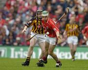 12 September 2004; Niall McCarthy, Cork, in action against Peter Barry, Kilkenny. Guinness All-Ireland Senior Hurling Championship Final, Cork v Kilkenny, Croke Park, Dublin. Picture credit; Brendan Moran / SPORTSFILE *** Local Caption *** Any photograph taken by SPORTSFILE during, or in connection with, the 2004 Guinness All-Ireland Hurling Final which displays GAA logos or contains an image or part of an image of any GAA intellectual property, or, which contains images of a GAA player/players in their playing uniforms, may only be used for editorial and non-advertising purposes.  Use of photographs for advertising, as posters or for purchase separately is strictly prohibited unless prior written approval has been obtained from the Gaelic Athletic Association.