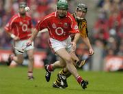 12 September 2004; Jerry O'Connor, Cork, in action against Eddie Brennan, Kilkenny. Guinness All-Ireland Senior Hurling Championship Final, Cork v Kilkenny, Croke Park, Dublin. Picture credit; Brendan Moran / SPORTSFILE *** Local Caption *** Any photograph taken by SPORTSFILE during, or in connection with, the 2004 Guinness All-Ireland Hurling Final which displays GAA logos or contains an image or part of an image of any GAA intellectual property, or, which contains images of a GAA player/players in their playing uniforms, may only be used for editorial and non-advertising purposes.  Use of photographs for advertising, as posters or for purchase separately is strictly prohibited unless prior written approval has been obtained from the Gaelic Athletic Association.