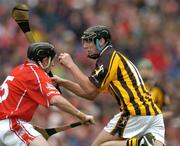 12 September 2004; John Hoyne, Kilkenny, in action against John Gardiner, Cork. Guinness All-Ireland Senior Hurling Championship Final, Cork v Kilkenny, Croke Park, Dublin. Picture credit; Brendan Moran / SPORTSFILE *** Local Caption *** Any photograph taken by SPORTSFILE during, or in connection with, the 2004 Guinness All-Ireland Hurling Final which displays GAA logos or contains an image or part of an image of any GAA intellectual property, or, which contains images of a GAA player/players in their playing uniforms, may only be used for editorial and non-advertising purposes.  Use of photographs for advertising, as posters or for purchase separately is strictly prohibited unless prior written approval has been obtained from the Gaelic Athletic Association.