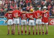12 September 2004; Cork players, l to r, Ben O'Connor, Brian Corcoran, Kieran Murphy, Joe Deane, Niall McCarthy and Timmy McCarthy stand for a minutes silence in memory of the victims of the Beslan tragedy and Richie Mullally, father of Kilkenny panellists Eddie and Richard who past away Saturday night. Guinness All-Ireland Senior Hurling Championship Final, Cork v Kilkenny, Croke Park, Dublin. Picture credit; Damien Eagers / SPORTSFILE *** Local Caption *** Any photograph taken by SPORTSFILE during, or in connection with, the 2004 Guinness All-Ireland Hurling Final which displays GAA logos or contains an image or part of an image of any GAA intellectual property, or, which contains images of a GAA player/players in their playing uniforms, may only be used for editorial and non-advertising purposes.  Use of photographs for advertising, as posters or for purchase separately is strictly prohibited unless prior written approval has been obtained from the Gaelic Athletic Association.