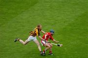 12 September 2004; Tom Kenny, Cork, in action against James Ryall, Kilkenny. Guinness All-Ireland Senior Hurling Championship Final, Cork v Kilkenny, Croke Park, Dublin. Picture credit; Pat Murphy / SPORTSFILE *** Local Caption *** Any photograph taken by SPORTSFILE during, or in connection with, the 2004 Guinness All-Ireland Hurling Final which displays GAA logos or contains an image or part of an image of any GAA intellectual property, or, which contains images of a GAA player/players in their playing uniforms, may only be used for editorial and non-advertising purposes.  Use of photographs for advertising, as posters or for purchase separately is strictly prohibited unless prior written approval has been obtained from the Gaelic Athletic Association.