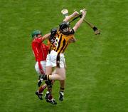 12 September 2004; Jerry O'Connor, Cork, in action against Peter Barry and Derek Lyng, partially hidden, Kilkenny. Guinness All-Ireland Senior Hurling Championship Final, Cork v Kilkenny, Croke Park, Dublin. Picture credit; Pat Murphy / SPORTSFILE *** Local Caption *** Any photograph taken by SPORTSFILE during, or in connection with, the 2004 Guinness All-Ireland Hurling Final which displays GAA logos or contains an image or part of an image of any GAA intellectual property, or, which contains images of a GAA player/players in their playing uniforms, may only be used for editorial and non-advertising purposes.  Use of photographs for advertising, as posters or for purchase separately is strictly prohibited unless prior written approval has been obtained from the Gaelic Athletic Association.