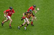 12 September 2004; DJ Carey, Kilkenny, in action against Cork's John Gardiner, right, and Ben O'Connor. Guinness All-Ireland Senior Hurling Championship Final, Cork v Kilkenny, Croke Park, Dublin. Picture credit; Pat Murphy / SPORTSFILE *** Local Caption *** Any photograph taken by SPORTSFILE during, or in connection with, the 2004 Guinness All-Ireland Hurling Final which displays GAA logos or contains an image or part of an image of any GAA intellectual property, or, which contains images of a GAA player/players in their playing uniforms, may only be used for editorial and non-advertising purposes.  Use of photographs for advertising, as posters or for purchase separately is strictly prohibited unless prior written approval has been obtained from the Gaelic Athletic Association.