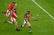 12 September 2004; DJ Carey, Kilkenny, in action against Ben O'Connor and John Gardiner, top, Cork. Guinness All-Ireland Senior Hurling Championship Final, Cork v Kilkenny, Croke Park, Dublin. Picture credit; Pat Murphy / SPORTSFILE *** Local Caption *** Any photograph taken by SPORTSFILE during, or in connection with, the 2004 Guinness All-Ireland Hurling Final which displays GAA logos or contains an image or part of an image of any GAA intellectual property, or, which contains images of a GAA player/players in their playing uniforms, may only be used for editorial and non-advertising purposes.  Use of photographs for advertising, as posters or for purchase separately is strictly prohibited unless prior written approval has been obtained from the Gaelic Athletic Association.