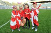 29 September 2013; Cork's Deirdre O'Reilly celebrates with her nieces and nephew, from left, Ailey Lyons, age 5, Annie O'Reilly, age 5 and Keelin Lyons, age 7, after the game. TG4 All-Ireland Ladies Football Senior Championship Final, Cork v Monaghan, Croke Park, Dublin. Picture credit: Brendan Moran / SPORTSFILE