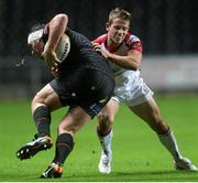 4 October 2013; Ryan Bevington, Ospreys, is tackled by Paul Marshall, Ulster. Celtic League 2013/14, Round 5, Ospreys v Ulster, Liberty Stadium, Swansea, Wales. Picture credit: Steve Pope / SPORTSFILE