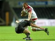 4 October 2013; Dan Tuohy, Ulster, is tackled by Dan Biggar, Ospreys. Celtic League 2013/14, Round 5, Ospreys v Ulster, Liberty Stadium, Swansea, Wales. Picture credit: Steve Pope / SPORTSFILE