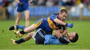 6 October 2013; Mark Smith, Longford Slashers, is tackled to the ground by David Pettit, Dromard. Longford County Senior Club Football Championship Final, Longford Slashers v Dromard, Glennon Brothers Pearse Park, Longford. Picture credit: Matt Browne / SPORTSFILE