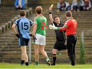 6 October 2013; St Brigid's goalkeeper Shane Curran is shown a yellow card by referee Paddy Neilan for descent. Roscommon County Senior Club Football Championship Final, St Brigid's v Western Gaels, Dr. Hyde Park, Roscommon. Picture credit: Pat Murphy / SPORTSFILE
