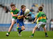 6 October 2013; Shane Glynn, Eastern Gaels, is tackled by Liam Jones, left, and Brian Moyles, Ardnaree Sarsfields, during the Connacht Play and Stay Day games. Ardnaree Sarsfields GAA, Ardnaree, Ballina, Co. Mayo, v Eastern Gaels GAA, Claremorris, Mayo. Croke Park, Dublin. Picture credit: Ray McManus / SPORTSFILE