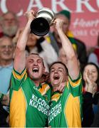 6 October 2013; Kilcormac/Killoughey's Peter Healion, left, and Ciarán Slevin lift the Sean Robins Cup following their victory over Birr. Offaly County Senior Club Hurling Championship Final, Kilcormac/Killoughey v Birr, O'Connor Park, Tullamore, Co. Offaly. Picture credit: Stephen McCarthy / SPORTSFILE