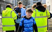10 March 2025; A St Michael's College supporter enters past security before the Bank of Ireland Leinster Rugby Boys Schools Junior Cup semi-final match between St Michael's College and Clongowes Wood College at Energia Park in Dublin. Photo by Shauna Clinton/Sportsfile