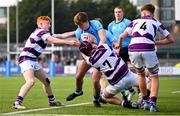 10 March 2025; Matthew McKenna of St Michael's College is tackled by Clongowes Wood College players Robert Wyse, left, and Senan Walsh during the Bank of Ireland Leinster Rugby Boys Schools Junior Cup semi-final match between St Michael's College and Clongowes Wood College at Energia Park in Dublin. Photo by Shauna Clinton/Sportsfile