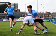 10 March 2025; Sam Dunne of St Michael's College is tackled by Ryan Mahon of Clongowes Wood College during the Bank of Ireland Leinster Rugby Boys Schools Junior Cup semi-final match between St Michael's College and Clongowes Wood College at Energia Park in Dublin. Photo by Shauna Clinton/Sportsfile