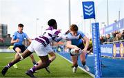 10 March 2025; Sam Dunne of St Michael's College attempts to score a try depsite the efforts of Harry Lawlor of Clongowes Wood College during the Bank of Ireland Leinster Rugby Boys Schools Junior Cup semi-final match between St Michael's College and Clongowes Wood College at Energia Park in Dublin. Photo by Shauna Clinton/Sportsfile