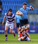 10 March 2025; Dara Elliott of St Michael's College is tackled by Tom English of Clongowes Wood College during the Bank of Ireland Leinster Rugby Boys Schools Junior Cup semi-final match between St Michael's College and Clongowes Wood College at Energia Park in Dublin. Photo by Shauna Clinton/Sportsfile