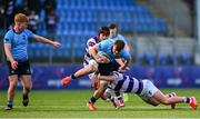 10 March 2025; Dara Elliott of St Michael's College is tackled by Tom English of Clongowes Wood College during the Bank of Ireland Leinster Rugby Boys Schools Junior Cup semi-final match between St Michael's College and Clongowes Wood College at Energia Park in Dublin. Photo by Shauna Clinton/Sportsfile