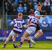 10 March 2025; Oliver Maybury of St Michael's College is tackled by Shaun Priede of Clongowes Wood College during the Bank of Ireland Leinster Rugby Boys Schools Junior Cup semi-final match between St Michael's College and Clongowes Wood College at Energia Park in Dublin. Photo by Shauna Clinton/Sportsfile