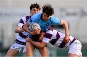 10 March 2025; Austin Currivan of St Michael's College is tackled by Tom English of Clongowes Wood College during the Bank of Ireland Leinster Rugby Boys Schools Junior Cup semi-final match between St Michael's College and Clongowes Wood College at Energia Park in Dublin. Photo by Shauna Clinton/Sportsfile