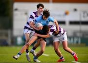 10 March 2025; Austin Currivan of St Michael's College is tackled by Tom English of Clongowes Wood College during the Bank of Ireland Leinster Rugby Boys Schools Junior Cup semi-final match between St Michael's College and Clongowes Wood College at Energia Park in Dublin. Photo by Shauna Clinton/Sportsfile