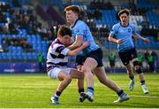 10 March 2025; Sam Dunne of St Michael's College is tackled by Harry Lawlor of Clongowes Wood College during the Bank of Ireland Leinster Rugby Boys Schools Junior Cup semi-final match between St Michael's College and Clongowes Wood College at Energia Park in Dublin. Photo by Shauna Clinton/Sportsfile