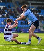 10 March 2025; Sam Dunne of St Michael's College evades the tackle of Harry Lawlor of Clongowes Wood College during the Bank of Ireland Leinster Rugby Boys Schools Junior Cup semi-final match between St Michael's College and Clongowes Wood College at Energia Park in Dublin. Photo by Shauna Clinton/Sportsfile