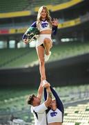 10 March 2025; Kansas State University and Iowa State University Cheerleader member Katelyn Egan is held aloft by Aron Castillo and Maddie Rose at the Aviva Stadium Dublin as tickets for the 2025 Aer Lingus College Football Classic between Kansas State University and Iowa State University are on sale now at www.ticketmaster.ie/collegefootball. The fixture will take place at the Aviva Stadium, Dublin, on Saturday, 23rd August 2025 and limited tickets are available. Photo by Ramsey Cardy/Sportsfile