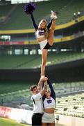 10 March 2025; Kansas State University and Iowa State University Cheerleader member Katelyn Egan is held aloft by Aron Castillo and Maddie Rose at the Aviva Stadium Dublin as tickets for the 2025 Aer Lingus College Football Classic between Kansas State University and Iowa State University are on sale now at www.ticketmaster.ie/collegefootball. The fixture will take place at the Aviva Stadium, Dublin, on Saturday, 23rd August 2025 and limited tickets are available. Photo by Ramsey Cardy/Sportsfile