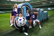10 March 2025; Kansas State University and Iowa State University Cheerleader members, from left, Katelyn Egan, Aron Castillo and Maddie Rose, alongside mascot Wille the Wildcat, at the Aviva Stadium Dublin as tickets for the 2025 Aer Lingus College Football Classic between Kansas State University and Iowa State University are on sale now at www.ticketmaster.ie/collegefootball. The fixture will take place at the Aviva Stadium, Dublin, on Saturday, 23rd August 2025 and limited tickets are available. Photo by Ramsey Cardy/Sportsfile