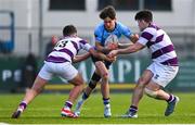 10 March 2025; Sebastian Perry of St Michael's College is tackled by Clongowes Wood College players Tom English, left, and Harry Lawlor during the Bank of Ireland Leinster Rugby Boys Schools Junior Cup semi-final match between St Michael's College and Clongowes Wood College at Energia Park in Dublin. Photo by Shauna Clinton/Sportsfile