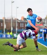 10 March 2025; Toby O'Leary of St Michael's College is tackled by Ryan Mahon of Clongowes Wood College during the Bank of Ireland Leinster Rugby Boys Schools Junior Cup semi-final match between St Michael's College and Clongowes Wood College at Energia Park in Dublin. Photo by Shauna Clinton/Sportsfile
