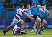 10 March 2025; Sam Kennedy of St Michael's College in action against Philip Kenny of Clongowes Wood College during the Bank of Ireland Leinster Rugby Boys Schools Junior Cup semi-final match between St Michael's College and Clongowes Wood College at Energia Park in Dublin. Photo by Shauna Clinton/Sportsfile