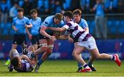10 March 2025; Sam Kennedy of St Michael's College is tackled by Clongowes Wood College players Philip Kenny, left, and Tom English during the Bank of Ireland Leinster Rugby Boys Schools Junior Cup semi-final match between St Michael's College and Clongowes Wood College at Energia Park in Dublin. Photo by Shauna Clinton/Sportsfile