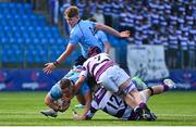 10 March 2025; Herbie Boyle of St Michael's College is tackled by Clongowes Wood College players Daniel Maguire, left, and Senan Walsh during the Bank of Ireland Leinster Rugby Boys Schools Junior Cup semi-final match between St Michael's College and Clongowes Wood College at Energia Park in Dublin. Photo by Shauna Clinton/Sportsfile