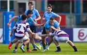 10 March 2025; Herbie Boyle of St Michael's College in action against Clongowes Wood College players Sean Crowe, left, and Senan Walsh during the Bank of Ireland Leinster Rugby Boys Schools Junior Cup semi-final match between St Michael's College and Clongowes Wood College at Energia Park in Dublin. Photo by Shauna Clinton/Sportsfile