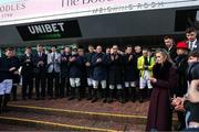 11 March 2025: Family of Michael O’Sullivan and jockeys observe a minute’s silence prior to racing on day one of the Cheltenham Racing Festival at Prestbury Park in Cheltenham, England. Photo by Harry Murphy/Sportsfile