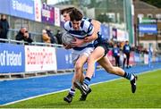11 March 2025; Tim Daly of Blackrock College is tackled by Luuk Jackson of St Vincent's Castleknock College during the Bank of Ireland Leinster Rugby Boys Schools Junior Cup semi-final match between Blackrock College and St Vincent's Castleknock College at Energia Park in Dublin. Photo by Shauna Clinton/Sportsfile