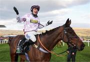 11 March 2025: Lorcan Williams, aboard Golden Ace, celebrates after winning the Unibet Champion Hurdle on day one of the Cheltenham Racing Festival at Prestbury Park in Cheltenham, England. Photo by Harry Murphy/Sportsfile